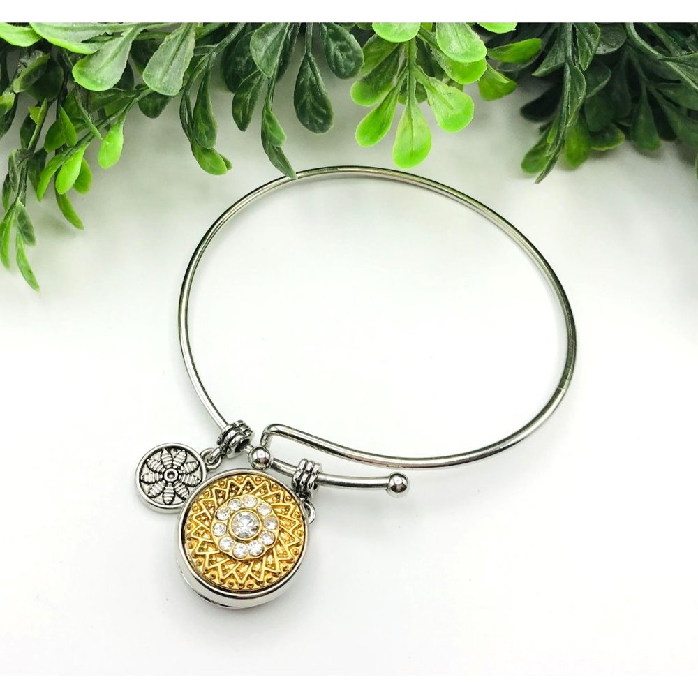 Ginger Snap Bracelet silver tone with a gold and silver tone snap and rhinestone